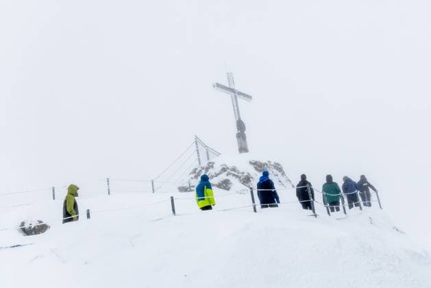 Deep Anett snow in the Bavarian Alps The heights of the Allgäu Alps at the summit cross on the Nebelhorn are covered in deep snow, Oberstdorf Bavaria Germany