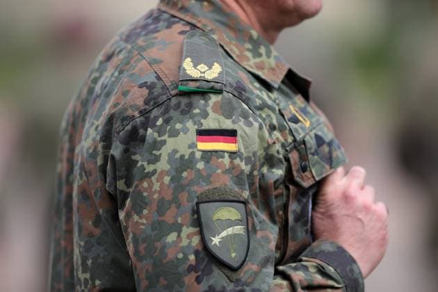 Uniform with epaulettes and rank Brigadier General on spot camouflage suit of Brigadier General Andreas Steinhaus, Commander of Airborne Brigade 1 LLBrig 1 in Saarlouis Federal Minister of Defense Boris Pistorius visits the Airborne Brigade 1 LLBrig 1 of the Bundeswehr in Saarlouis Saarlouis Saarland Germany on September 17, 2024