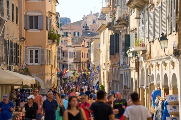 Corfu, Greece - September 4, 2024: Crowds in the old town of Corfu, capturing the lively atmosphere of a tourist hotspot, typical of mass tourism in popular destinations