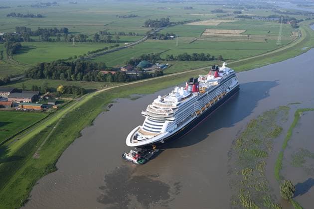 Meyer Werft transfers new cruise ship Disney Treasure The newly built cruise ship Disney Treasure has left the Meyer Werft shipyard and is being towed across the Ems by tugboats The shipyard began this morning with the transfer of the approximately 340 meter long cruise ship across the Ems from Papenburg to Eemshaven Papenburg Lower Saxony Germany Copyright: xdiebildwerftx