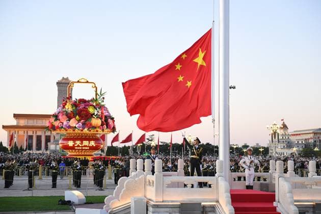 (241001) -- BEIJING, Oct. 1, 2024 -- A flag-raising ceremony marking the 75th anniversary of the founding of the People s Republic of China is held at the Tian anmen Square in Beijing, capital of China, Oct. 1, 2024. ) XINHUA PHOTOS OF THE DAY ChenxZhonghao