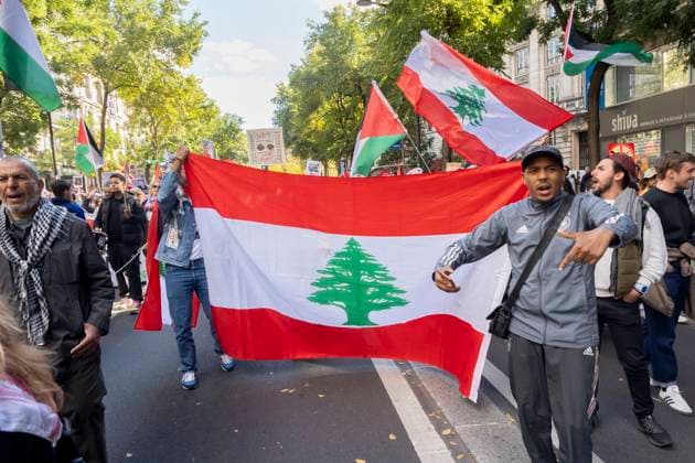 Paris, France October 5, 2024 - Demonstration organized by the Association France Palestine SolidaritÃ (AFPS) to denounce Israel s war in Gaza and Lebanon. Pro-Palestinian demonstrators are participating in national marches across EMEA to mark the start of Israel s war in Gaza after the Hamas attacks of October 7th 2023. They are calling for a ceasefire in the Middle East and an end to the supply of arms to Israel GUERRE, MANIFESTATION PRO PALESTINIENNE, GAZA, PROCHE ORIENT, MOYEN ORIENT, MIDDLE EAST, LIBAN, CONFLIT, GEOPOLITIQUE, ISRAEL, MANIFESTANTS, ARABES, POLITIQUE, GOUVERNEMENT, DIASPORA, MOUVEMENT DE RESISTANCE, TERRITOIRES PALESTINIENS OCCUPES, DRAPEAU LIBANAIS, LIBAN  Copyright: xVincentxIsorex