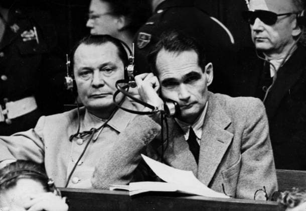 Orig caption THEY WILL BE HANGED N P M from left to right GOERING, HESS and RIBBENTROP, in the dock Goering and Ribbentrop, guilty of 4 counts, will be hanged As for Hess, against whom only two counts have been brought, he will be spared his life he is sentenced to prison for life Note Headphones persons HERMANN GÖRING  Copyright: xXxXxXx THE NUREMBERG PROCESS