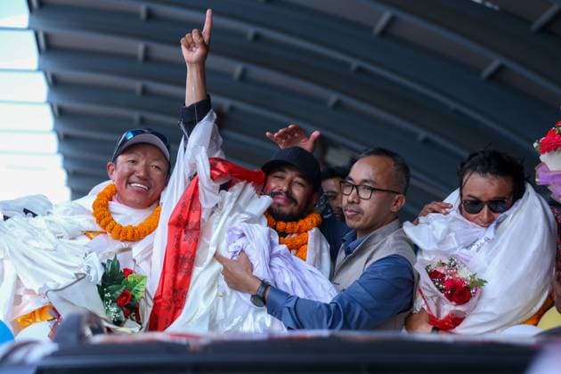 Record Holding Mountain Climbers Gets Rousing Welcome Upon Arrival Back Home Record-setting climber Nirmal Purja, also known as Nimsdai, signals victory as he arrives back in Kathmandu, Nepal, on October 14, 2024, after completing the summit of 14 peaks towering above 8000 meters without oxygen. On May 7, 2022, climber Nims begins this campaign by summiting Kanchenjunga without using supplemental oxygen. On May 27 of the same year, he ascends Everest, followed by Lhotse on May 28, Makalu, Cho Oyu, Dhaulagiri, Annapurna, Manaslu, Nanga Parbat, Gasherbrum, Broad Peak, and finally Shishapangma. Out of the 14 tallest peaks, eight are located in Nepal, while the others are in Pakistan and China. Kathmandu Nepal Copyright: xSubaasxShresthax originalFilename: shrestha-recordho241014_np8zh.jpg