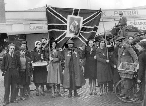 Orig. caption... POPPY RIOTS IN DUBLIN. Riotous scenes occurred in Dublin following Armistice Day celebrations. Police made baton charges against a mob of 2000 youths who pounced upon people wearing poppies and tore them from their coats. A group of participants in the celebrations who carried the Union Jack were attacked, and after the police had cleared things the Union Jack was confiscated. Photo shows:- The Union Jack which was afterwards confiscated by the police as it is contrary to orders to carry it in the Free State, and some of the participants who carried it and were attacked. November 12th 1932 Note. Armistice Day was celebrated on November 11 in the years 1919-1938 in memory of those who fell in the First World War. Hand in poc  Copyright: xx MEMORIAL DAY CELEBRATED WITH THE BRITISH FLAG