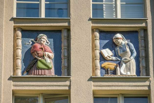 Midwives, relief on old building, former womens and childrens clinic, today Wohnpark St Marien, Mariendorfer Weg, Neukölln, Berlin, Germany
