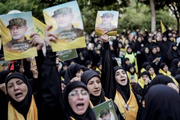 September 22, 2024, Beirut, Beirut, Lebanon:Lebanese women holding photos of Hezbollah commander IBRAHIM AQIL and mourning at his funeral in Dahiya, Beirut, Lebanon. Beirut Lebanon  - ZUMA 20240922_int_m272_002 Copyright: xMohammadxMohsenifarx