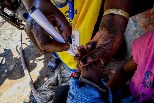 October 4, 2024, Nairobi, Kenya: A community health worker seen marking a Childs finger after an oral polio vaccination in Kibera Slums. Polio is a virus that may cause paralysis and is easily preventable through polio vaccine. The virus is easily transmitted through fecal-oral route, contaminated water, Food or body contact with an infected person including respiratory droplets that could lead to a fatal paralysis if no quick medical diagnosis is taken. It mostly affects kids under 5 years of age but also anyone of a different age, who is not vaccinated can contact the diseases. The Kenya Paediatric Association (KPA), a non-profit professional organization including pediatricians, clinicians and local community Health Workers unite they on - ZUMAs197 20241004_aab_s197_041 Copyright: xDonwilsonxOdhiambox
