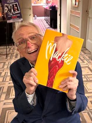 December 2, 2024, New York, New York, USA: American fashion designer and costumier BOB MACKIE holds his UNMISTAKABLY MACKIE book at the press preview for the Hollywood Legends Ã¢â‚¬ËœUnmistakably MackieÃ¢â‚¬â ¢ auction presented by JulienÃ¢â‚¬â ¢s Auctions and Turner Classic Movies held at the Carlyle Hotel. New York USA - ZUMAk03_ 20241202_zaf_k03_079 Copyright: xNancyxKaszermanx