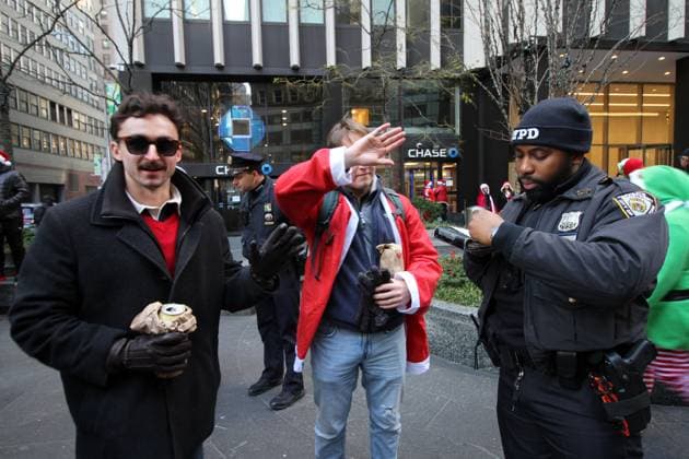 December 14, 2024, Manhattan, New York, USA: New York, New York, December 14, 2024 . Santa Con 2024 NYC. SantaCon is a charitable, non-political, nonsensical Santa Claus convention that happens once a year to fund art & spread absurdist joy.. .NYPD issuing ticket for drinking in Public Manhattan U.S.A - ZUMAct2_ 20241214_faf_ct2_034 Copyright: xBrucexCotlerx