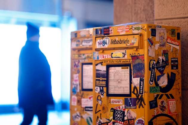 Two letterboxes in front of a kiosk in Cologne city center are covered in stickers Letter postage is set to rise at the beginning of 2025 Post is also set to become slower Symbol image, theme image Cologne, 26 12 2024 NRW Germany Copyright: xChristophxHardtx