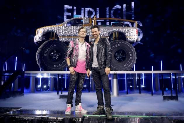 The magicians Christian Ehrlich l and Andreas Ehrlich, known as the Ehrlich Brothers, pose in front of a monster truck as part of their show Diamonds The best illusions from 10 years in the Lanxess Arena Cologne, 11 01 2025 NRW Germany Copyright: xChristophxHardtx