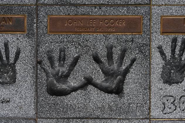 Handprints of John Lee Hooker on the rock walk in the entrance to the Guitar Center Music Store on Sunset Boulevard, Hollywood, Los Angeles, California, USA