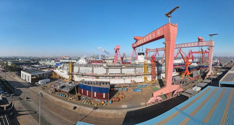 (250115) -- SHANGHAI, Jan. 15, 2025 -- An aerial drone photo taken on Jan. 15, 2025 shows the cruise ship Adora Flora City under construction at Shanghai Waigaoqiao Shipbuilding Co., Ltd. in Shanghai, east China. China on Wednesday completed the construction of the main structure for its second homegrown large cruise ship in Shanghai. The construction of the structure for the ship, Adora Flora City, took less than nine months -- over two months faster than the first ship, Adora Magic City, and this timeline is on par with the manufacturing processes of Europe s leading large cruise shipbuilders, according to Shanghai Waigaoqiao Shipbuilding Co., Ltd., manufacturer of the cruise ship. The next phase will focus on interior decoration,