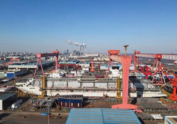 (250115) -- SHANGHAI, Jan. 15, 2025 -- An aerial drone photo taken on Jan. 15, 2025 shows the cruise ship Adora Flora City under construction at Shanghai Waigaoqiao Shipbuilding Co., Ltd. in Shanghai, east China. China on Wednesday completed the construction of the main structure for its second homegrown large cruise ship in Shanghai. The construction of the structure for the ship, Adora Flora City, took less than nine months -- over two months faster than the first ship, Adora Magic City, and this timeline is on par with the manufacturing processes of Europe s leading large cruise shipbuilders, according to Shanghai Waigaoqiao Shipbuilding Co., Ltd., manufacturer of the cruise ship. The next phase will focus on interior decoration,