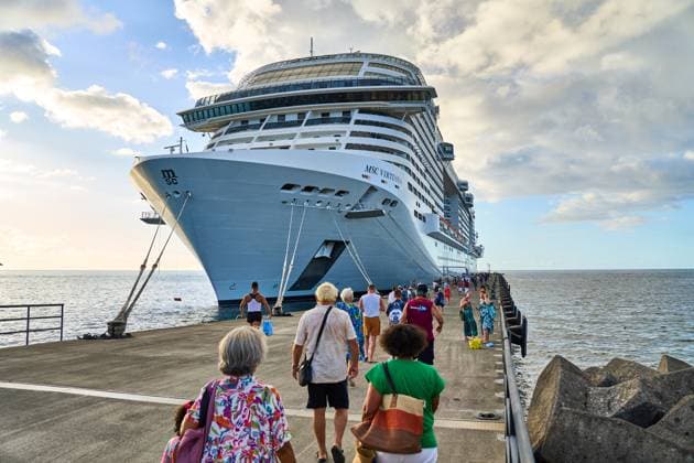 Saint George s, Grenada, Caribbean - January 10, 2025: Passengers board the cruise ship MSC Virtuosa in the port of Saint George s, Grenada.The MSC Virtuosa is one of the most modern ships in the Caribbean and a popular destination for cruise travelers