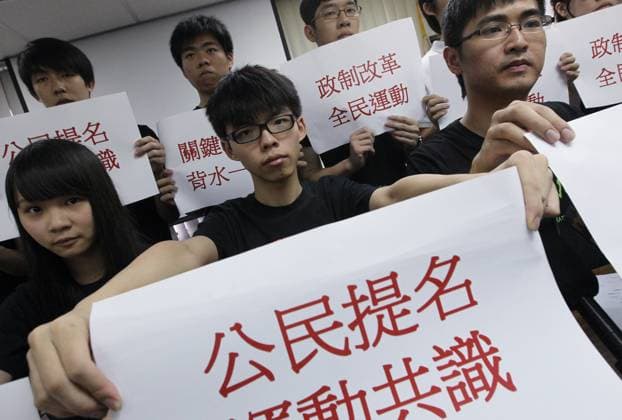 (Front row L to R) Scholarism spokeswoman Agnes Chow Ting, Scholarism convenor Joshua Wong Chi-fung, and HK Federation of Students president Alex Chow Yong-kang meet the media after their electoral reform plan won in a vote on models for a citywide referendum on political reform in Mong Kok. 07MAY14 HONG KONG CHINA EDITORIAL USE ONLY  Copyright: xx MER1405071538156970 FelixxWongx scmpphotos769916