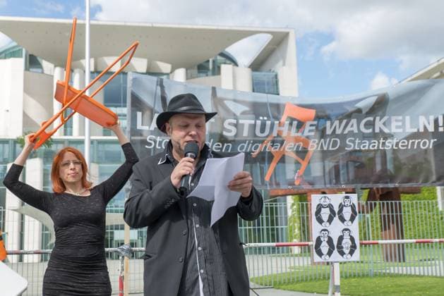 Bruno Kramm, Chairman the Pirate Party Berlin Calls to a Roundtable before the Chancellery in Berlin Let Chairs wobble on Chancellery as Protest against the Cooperation at worldwide Data espionage from BND and NSA Berlin Germany, Germany