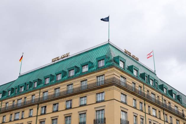 Berlin, Germany 03 October 2024 Hotel Adlon Kempinski blows the German Flag in Berlin, Germany 1127140083