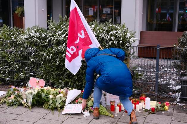 Mourners light candles at the site of the attack in Munich Mourners light candles and lay flowers at the site of the attack in Munich