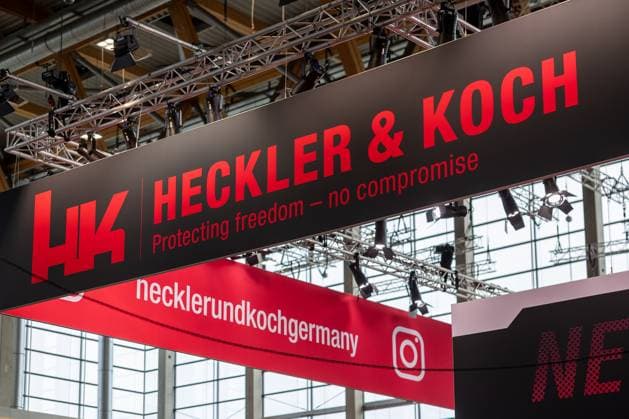 Enforce Tac 2025 International Trade Fair for Security and Defense, Nuremberg, 24 02 2025 Heckler Koch exhibition stand with large, illuminated company logo and the slogan Protecting freedom no compromise The company is a leading manufacturer of firearms for the military, police and security forces Nuremberg Dutzendteich Bavaria Germany 20250224-6V2A9900-M4000