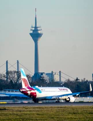 Eurowings Airbus aircraft on the taxiway, apron of Düsseldorf International Airport, Rhine bridges, Rhine Tower Düsseldorf, NRW, Germany, DUS Airport