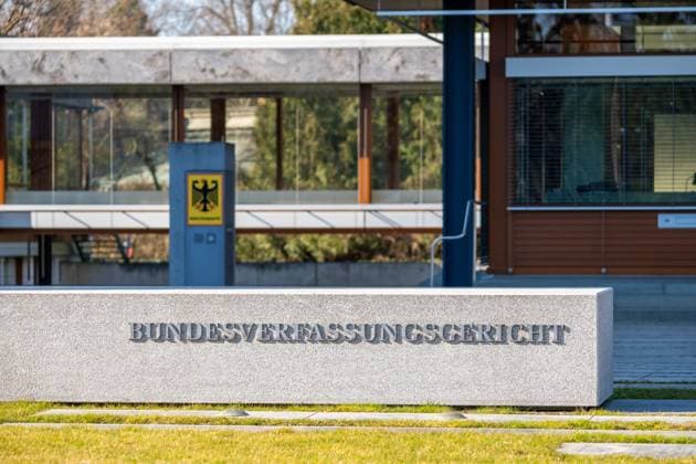 Karlsruhe, Baden-Württemberg, Germany - March 4, 2025: The massive stone block with the inscription Federal Constitutional Court in front of the building or court in Karlsruhe, next to the Federal Eagle of the Federal Republic of Germany as a coat of arms.