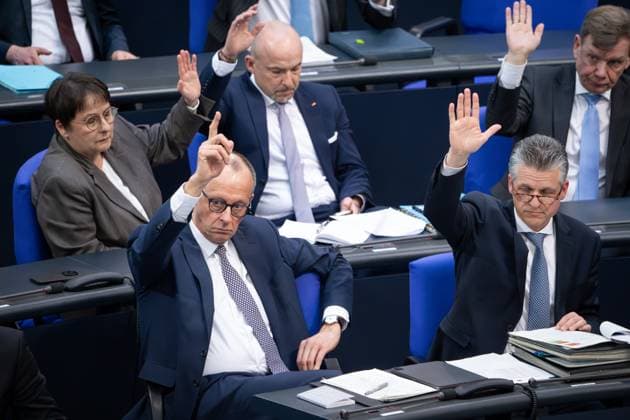 German Bundestag, 214th plenary session Friedrich Merz CDU together with his parliamentary group during the vote in the debate on the amendment of the Basic Law Art 109, 115, 143h, 87a at the 214th session of the German Bundestag in Berlin, 18 03 2025 Berlin Berlin Germany