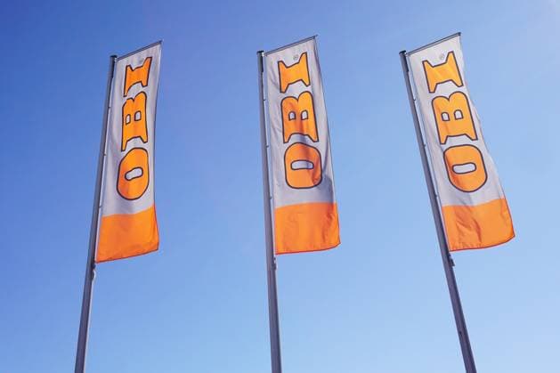 OBI, DIY store retail chain, Three Advertising banners before a Sales branch 1131602304