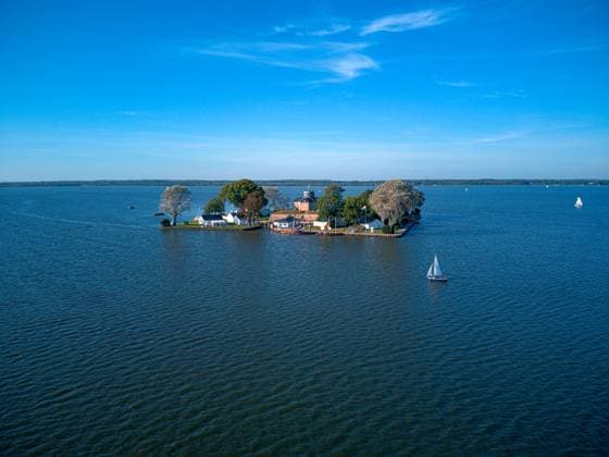 Wilhelmstein is an artificial island in lake Steinhuder Meer with an area of 12,500 square meters, located in the Hanover Region, Northern Germany. , 56381026.jpg, architecture, artificial, attraction, beach, boat, clouds, day, europe, famous, flag, fortifications, fortress, germany, hannover, hanover, historic, island, lake, landscape, middle, motorboat, nature, old, outdoor, park, pier, reflection, sailboat, sailing, sand, saxony, sea, seascape, shore, sight, sky, steinhude, stones, sun, swimming, tourism, touristic, travel, trees, view, village, water, waterfront, weather, wilhelmstein RECORD DATE NOT STATED