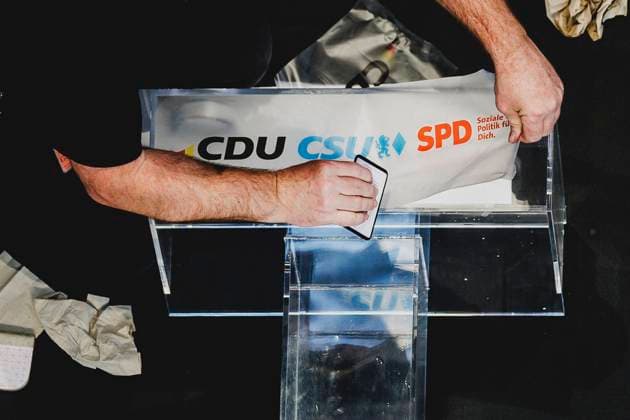 The lectern is labeled with the party logos of CDU, CSU and SPD before a press conference after successful coalition negotiations between SPD and CDU CSU in Berlin, 09 04 2025 Berlin Germany Copyright: xFlorianxGaertnerx