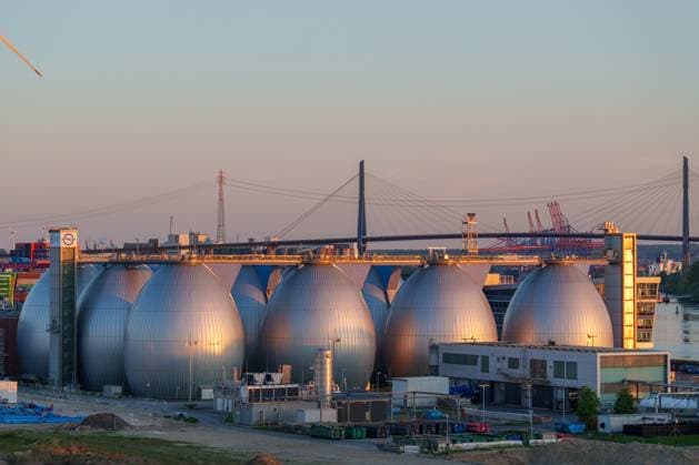 Hamburg, Germany - April 27, 2025: The striking digestion towers at the Köhlbrandhöft sewage treatment plant produce valuable biogas from sewage sludge for a sustainable energy supply.