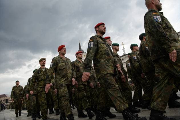 May 22, 2025, Vilnius, Lithuania: German soldiers march during the inauguration of the German Brigade ceremony. The German 45th Armored Brigade Lithuania was officially inaugurated at a ceremony held at Cathedral Square in Vilnius, with the participation of German Federal Chancellor Friedrich Merz, German Defence Minister Boris Pistorius, Lithuanian President Gitanas Naus?da, and Lithuanian Defence Minister Dovil? Å akalien?..Established in Lithuania on 1 April 2025, the brigade is projected to comprise around 5,000 Bundeswehr soldiers and civilian staff, with full combat readiness expected by 2027. Vilnius Lithuania - ZUMAs197 20250522_aaa_s197_219 Copyright: xYauhenxYerchakx