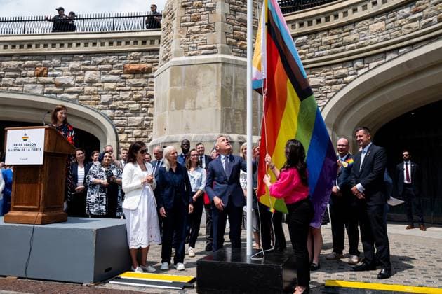 June 10, 2025, Ottawa, On, Canada: Prime Minister Mark Carney, centre left, takes part in a flag raising ceremony with Minister of Women and Gender Equality Rechie Valdez marking Pride month on Parliament Hill in Ottawa on Tuesday, June 10, 2025. Ottawa Canada  - ZUMAc35_ 20250610_zaf_c35_085 Copyright: xSpencerxColbyx