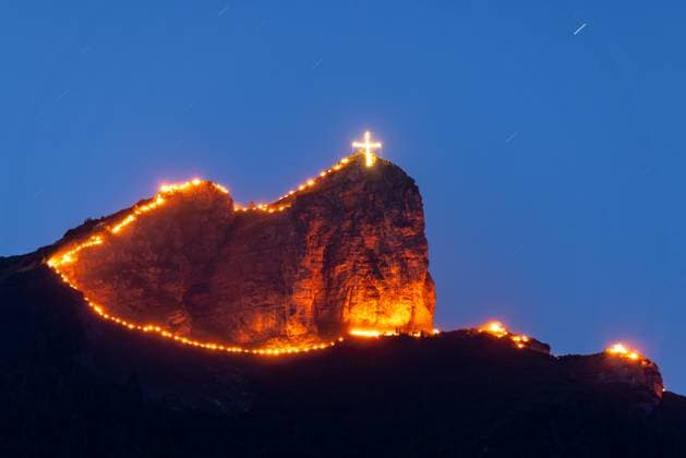 Solstice fires at Lake Achensee Mountain fires at the summer solstice can be seen at the Rotspitz on the Rofan, Maurach Tirol Austria