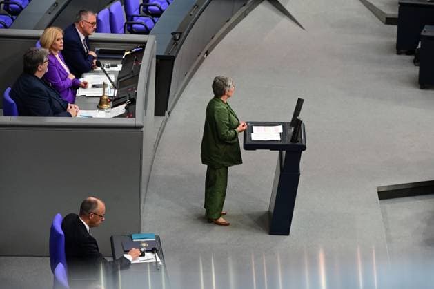Federal Chancellor Friedrich Merz CDU and parts of his cabinet sit on the government bench, whilec, Co-Chairman of the Greens parliamentary group, responds to the government statement by the Federal Chancellor, Federal Chancellor Friedrich Merz CDU