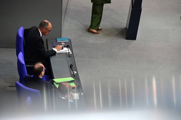 Federal Chancellor Friedrich Merz CDU and parts of his cabinet sit on the government bench, whilec, Co-Chairman of the Greens parliamentary group, responds to the government statement by the Federal Chancellor, Federal Chancellor Friedrich Merz CDU