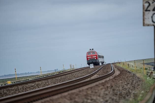 Deutsche Bahn AG InterCity train reaches the North Sea island of Sylt via the Hindenburgdamm View of a section of the marsh railroad leading from Hamburg and to Sylt with the Hindenburgdamm in Schleswig Holstein between the stations Niebüll and Westerland on the island of Sylt, Berlin Berlin Germany LOCATION