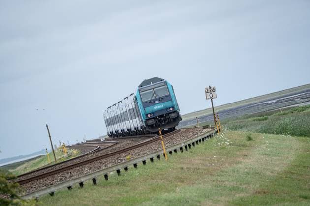 Regional express RE6 on the journey from Sylt to Hindenburgdamm View of a section of the Marschbahn line leading from Hamburg and to Sylt with Hindenburgdamm in Schleswig Holstein between the stations Niebüll and Westerland on the island of Sylt, Berlin Berlin Germany LOCATION