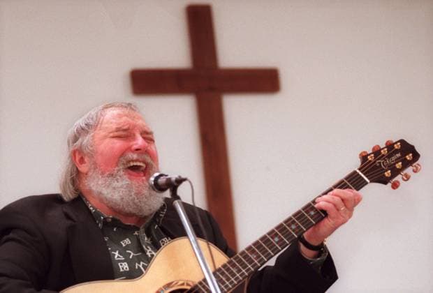 Florida News - April 25, 2007 PT 60695 - - DELIVER TO: Pasco - - 1 18 98 - - Zephyrhills - - CAPTION INFO: Charlie Daniels sings near a cross during Sunday service at the Angelus in Hudson. Proceeds from a full day of music at Zephyrhills Festival Park, with Charlie Daniels as the headliner, will benefit the Angelus. - - Times Photo by: John Pendygraft - - Story By: Jennifer Brett - - SCANNED BY: PEND - - RUN DATE: 1 19 98 Copyright: xStxPetersburgxTimesx