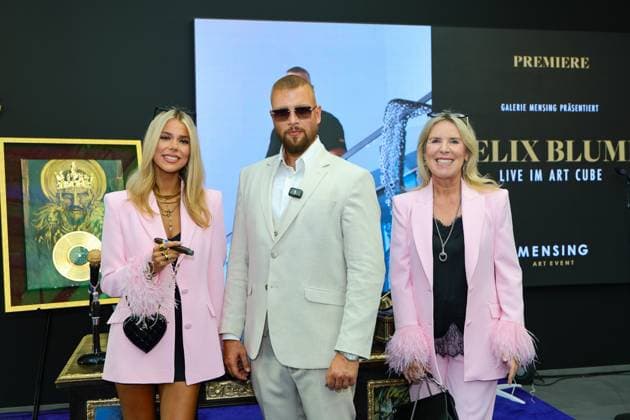 GRAND OPENING FELIX BLUME IN THE ART CUBE Patricia Viktoria Halbe with artist Felix Blume alis Kollegah and art collector Mariele Hense Halbe with the art in the background Hamm Galerie Mensing NRW Germany