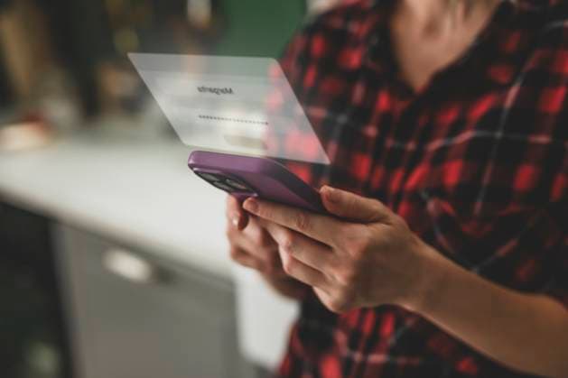 Secure login and identity verification on smartphone at home model released, Symbolfoto, VSNF03728
