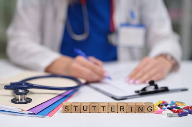 Dr. Taking Detailed Notes on Stuttering Patient Care and Treatment Strategies and Observations A healthcare professional documenting stuttering therapy plans, emphasizing communication disorders., model released, , 64329762.jpg RECORD DATE NOT STATED