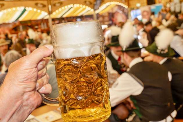 Mass beer, Augustiner, at the Aubing Autumn Festival, marquee, Munich, September 6, 2025 Germany, Munich, September 6, 2025, Mass beer, Augustiner, at the Aubing Autumn Festival, marquee, marquee visitors in traditional Bavarian costume, Bavaria