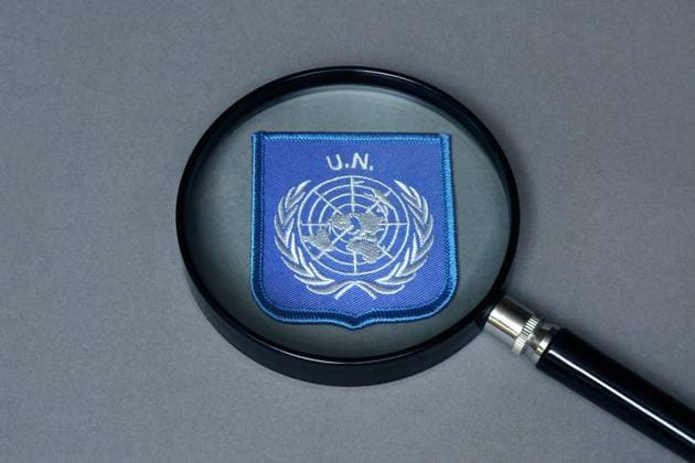 Magnifying glass with UN emblem Magnifying glass with UN emblem, 06 09 2025, Borkwalde, Brandenburg, There is a UN emblem under a magnifying glass