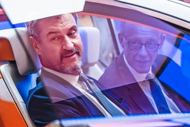 Federal Chancellor Merz and Minister President Söder in a concept car at the Qualcomm stand, tour of the exhibition at the opening of the IAA Mobility 2025, Messe Münch