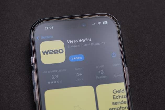 Smartphone shows the Logo the Wero wallet Application at his Screen 1103504019