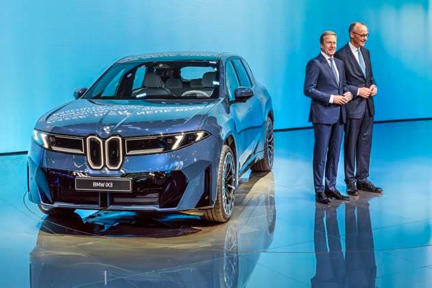 Federal Chancellor Friedrich Merz, BMW CEO Oliver Zipse, with the new BMW iX3, electric SUV, exhibition tour at the opening of the IAA Mobility 2025, Messe München, September 9, 2025 Germany, Munich, Sept