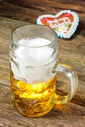 beer mug from the Oktoberfest in Munich A beer mug filled with beer at the Oktoberfest in Munich digitally processed as a symbolic image