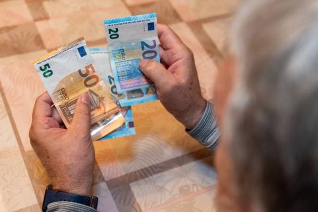 Germany - September 21, 2025: An elderly man counts several banknotes. The image refers to the discussion about pension reforms, political decisions, and securing the future for coming generations.